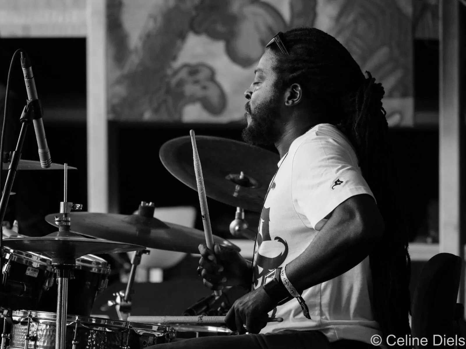 Jubba White performing on drums in black and white