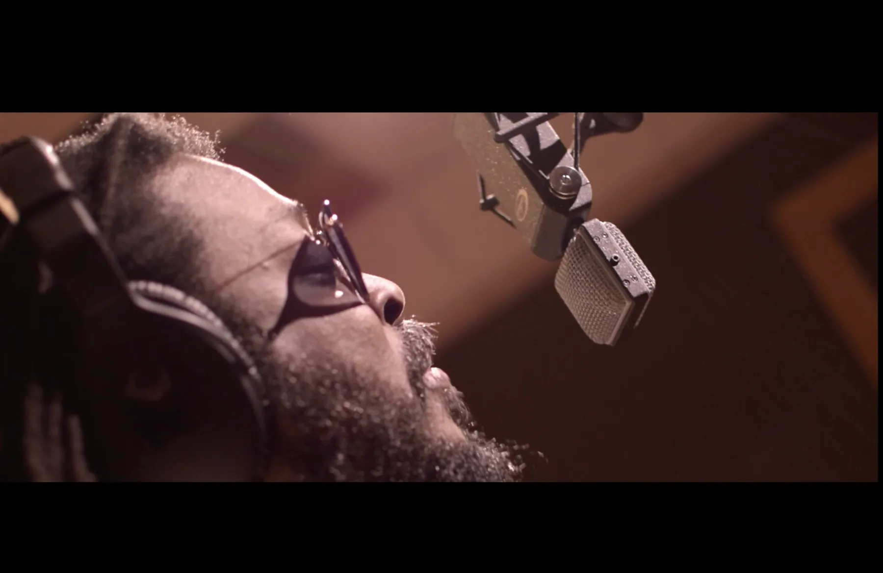 Jubba White recording vocals in a studio